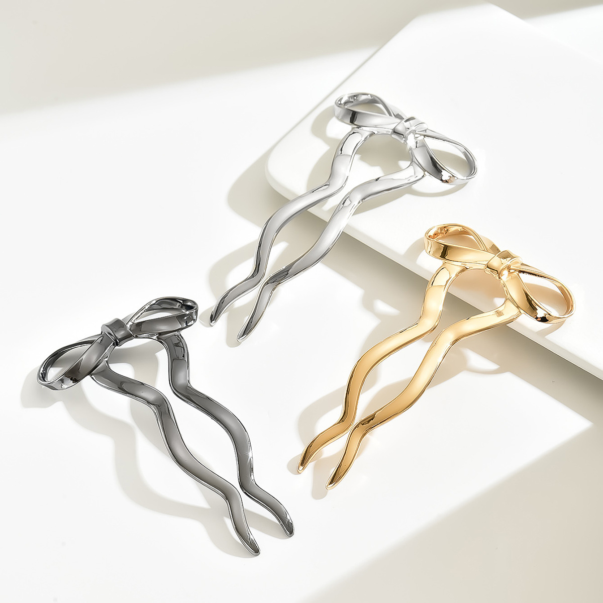 Comercio exterior nuevo clip de cabello de arco mujeres estilo minimalista estilo de alta sensibilidad joyería de cabello 2024 nuevo cabello enrolado joyería