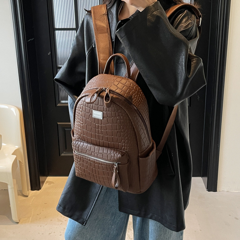 Moda coreana mochila de cuero suave para mujeres 2025 nuevo comercio exterior mochila de gran capacidad simple bolsa de viaje ligera
