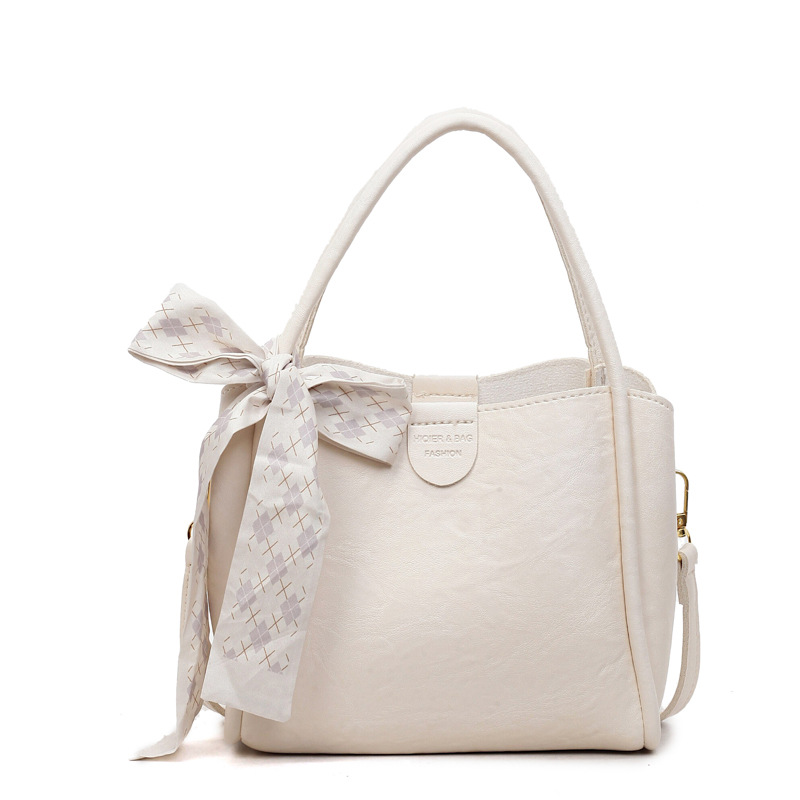 Bagos de transporte retro de estilo extranjero otoño y invierno 2025, nueva moda de un solo hombro, bolsas de cubo simples