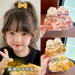 子供の皮の筋の冬の頭の縄の女の子は髪の毛の蝶結びの毛のボールを刺して傷つけません。