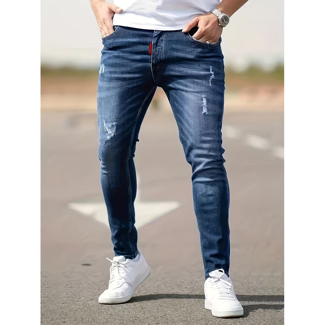 Jeans da uomo slim fit in denim elasticizzato | Jeans skinny strappati e dall'aspetto vissuto per uno stile casual da strada | Tessuto elasticizzato e confortevole_voghion.com
