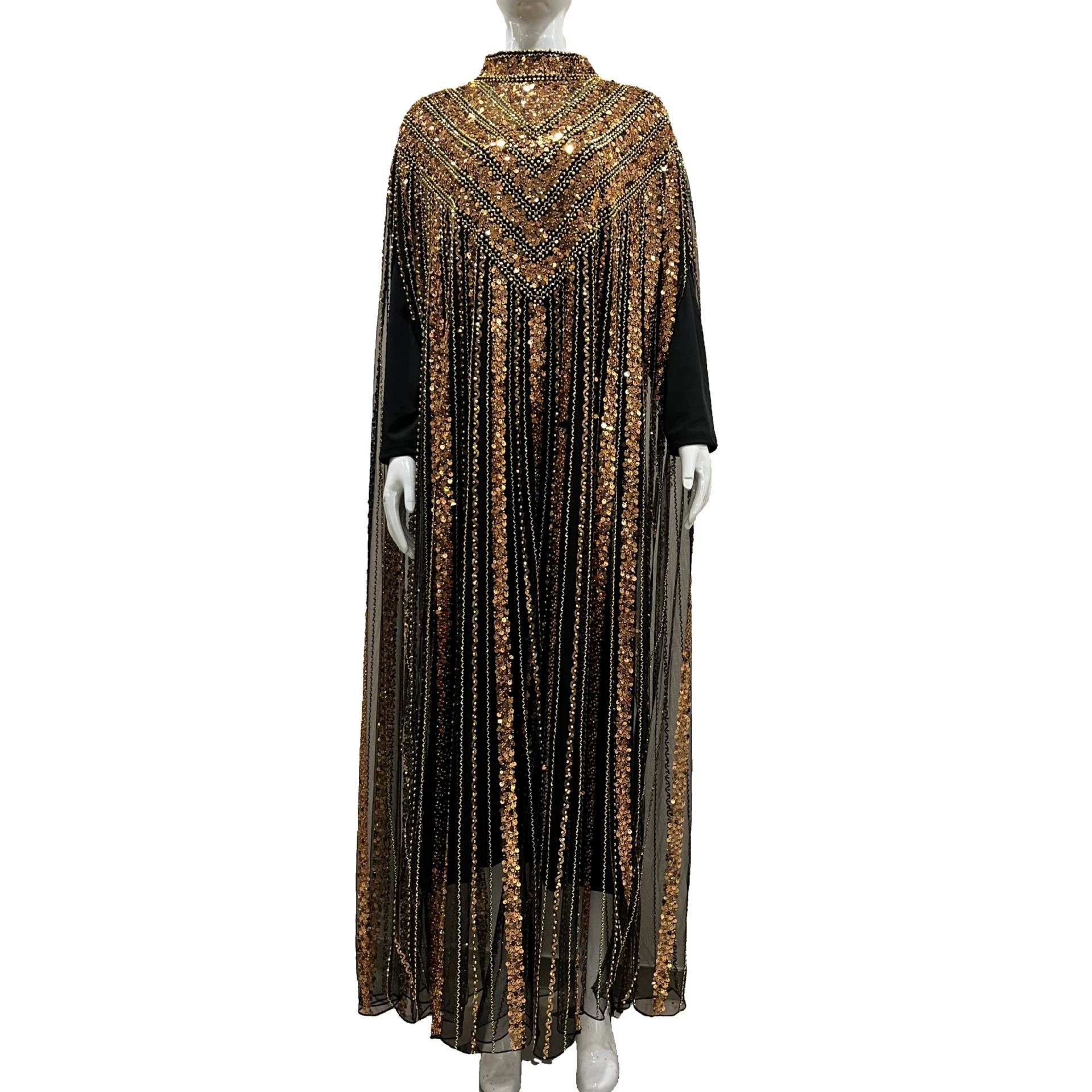 Two-piece beaded robe for women, featuring heavy gold, silver, and black sequins, and a flowing, loose-fitting mesh dress.