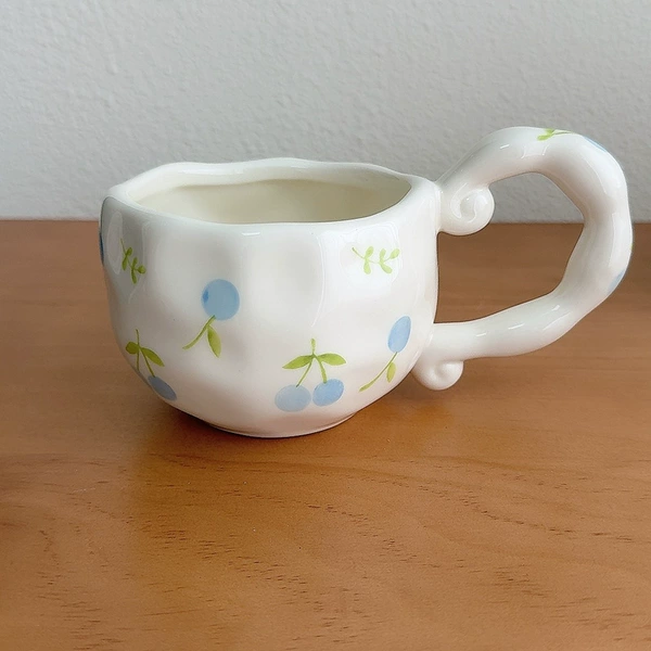 Irregular handle blue cherry pattern cup