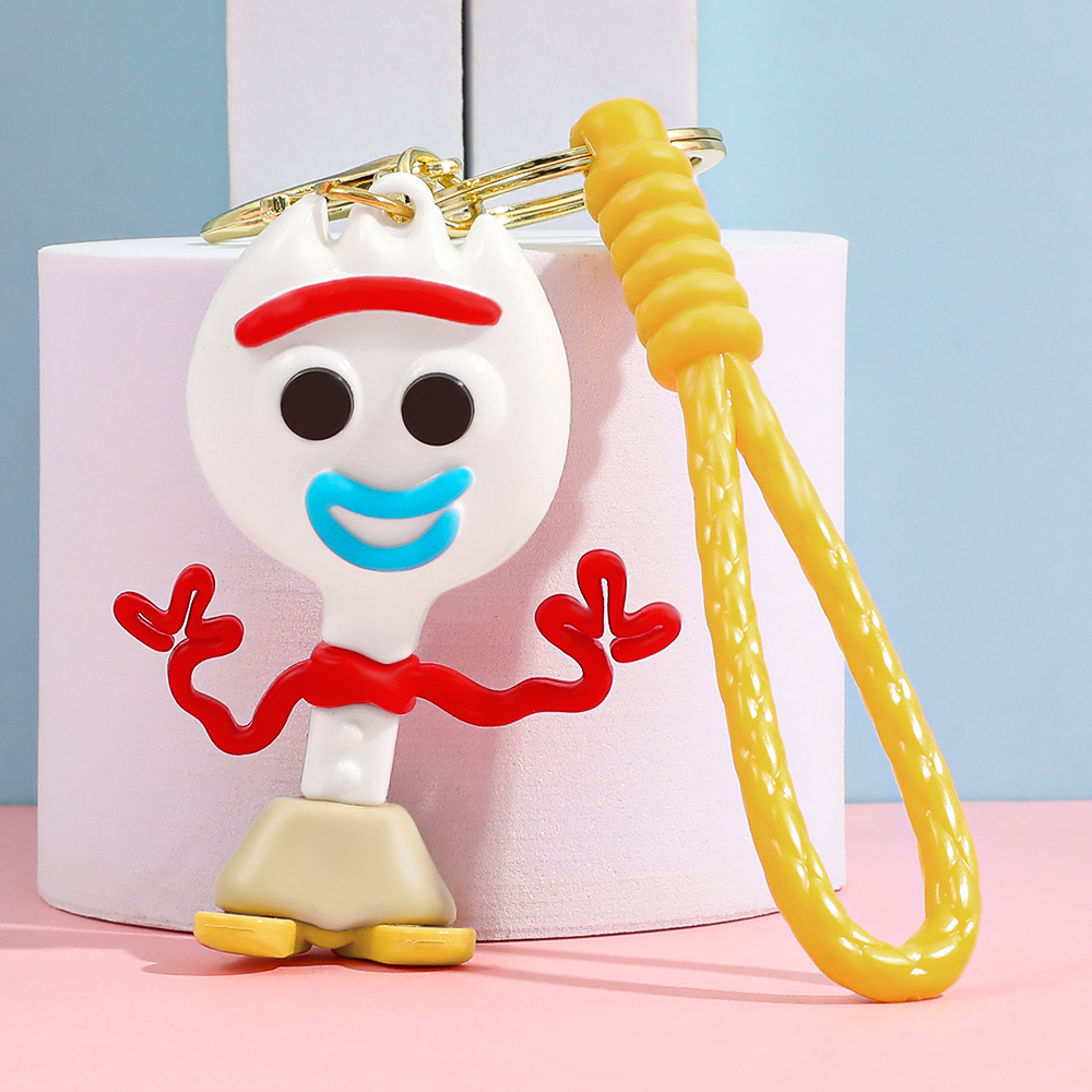 Llavero de silicona de Toy Story, el popular dibujo animado, con personajes como el alienígena de tres ojos, Buzz Lightyear y el oso Lotso, ideal como adorno para bolso.