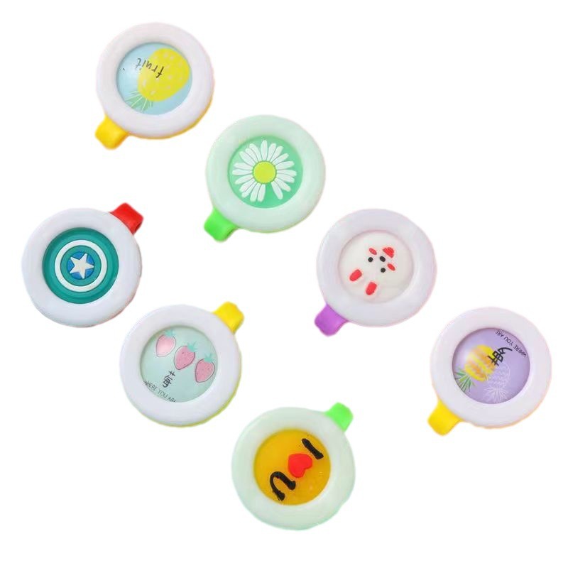 Fábrica directa de dibujos animados para niños viajes al aire libre botón de protección para bebés juguetes embarazadas perfumados botón de cuerpo sólido