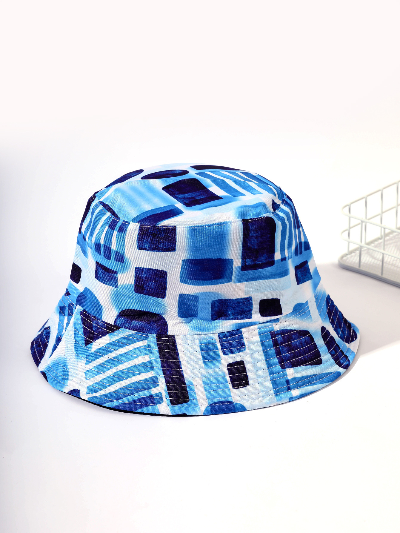 Verano nuevo doble cara de maraña teñida geométrica pescador sombrero de pasarela personalidad abstracta cuenca sombrero moda sombrero hombres y mujeres
