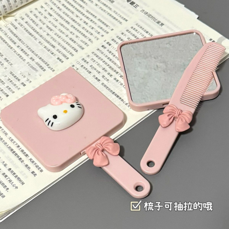 新しい種類のkitty猫のハンドルの鏡は櫛を持って携帯して化粧の鏡の少女の心の鏡の櫛の一体の小さい鏡を持ちます。|undefined