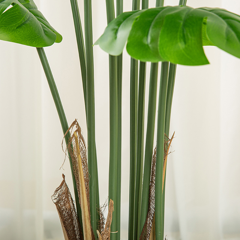 Los fabricantes producen plantas en macetas de monstera simuladas a gran escala, plantas verdes de simulación de piso, árboles de monstera, tamaños personalizables