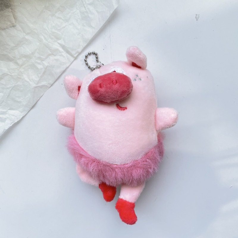 バレエ豚のペンダントピンクの子豚の人形人形人形が醜いぬいぐるみのかばんを飾っています。|undefined