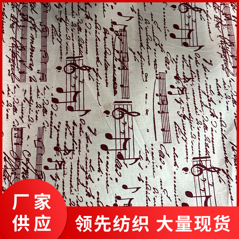 纯棉8安帆布胚布印红色音符布料，圣诞节布料