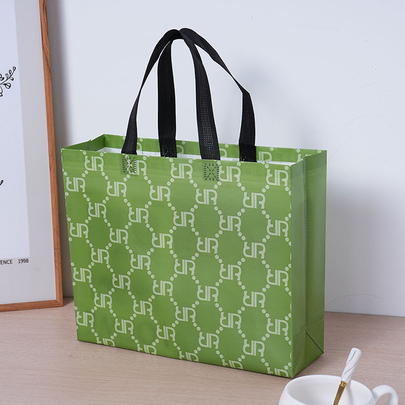 Bolsas de tela no tejida retro clásicas bolsas de compras portátiles publicitarias de ropa impresa en color bolsas de embalaje de película impresa personalizada stock