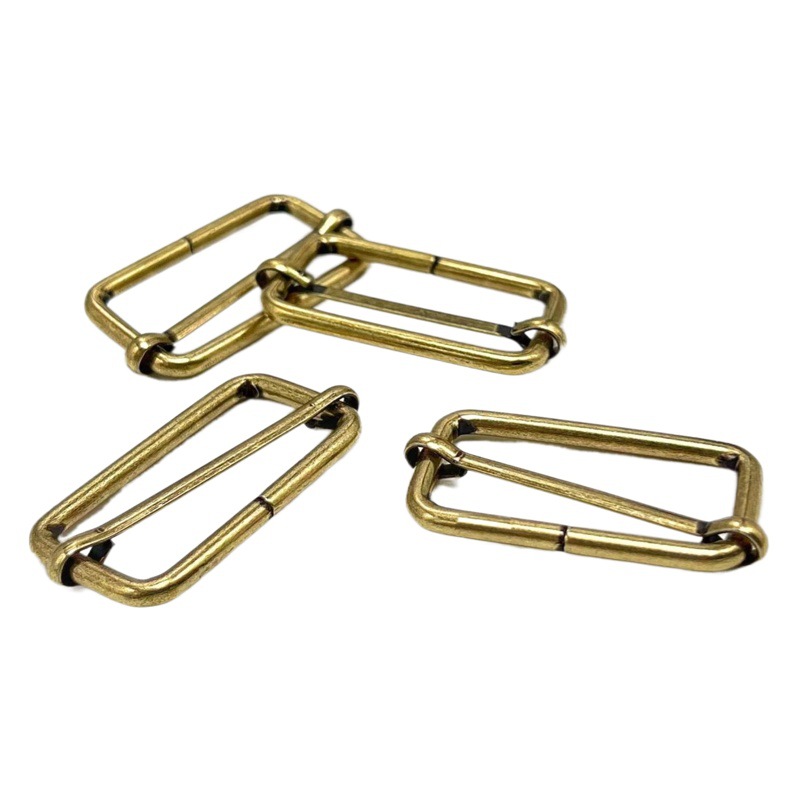 Venta directa de fábrica de hebillas metálicas en forma de D en stock, hebillas ajustables de acero inoxidable, nuevas hebillas de tracción, hebillas de tres niveles de cobre, hebillas de alambre de hierro.