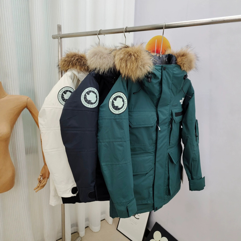 The North Face Summit Series hooded parka with faux fur trim, available in men's and women's sizes The North Face Summit Series hooded parka with faux fur trim, available in men's and women's sizes