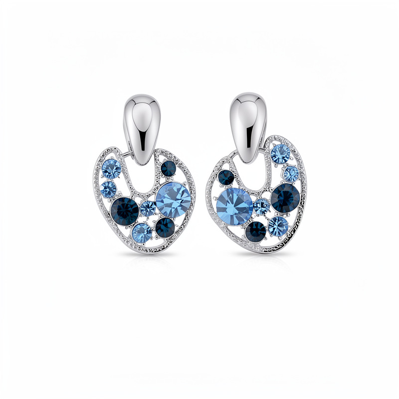 Agujas de plata con diamantes huecos pernos redondos azules personalidad de moda pendientes de lujo ligero pendientes de alta calidad para mujeres