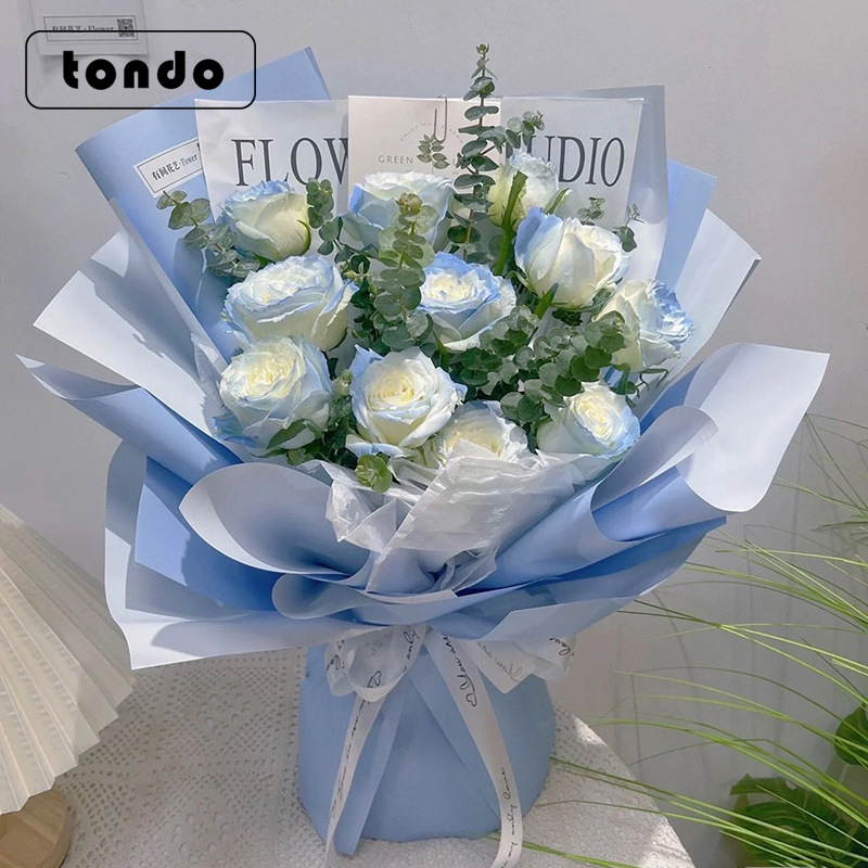 Papel de regalo de flores al por mayor de doble cara de dos colores de segunda generación Ouya papel engrosado impermeable ramo de flores frescas papel de regalo material de bricolaje