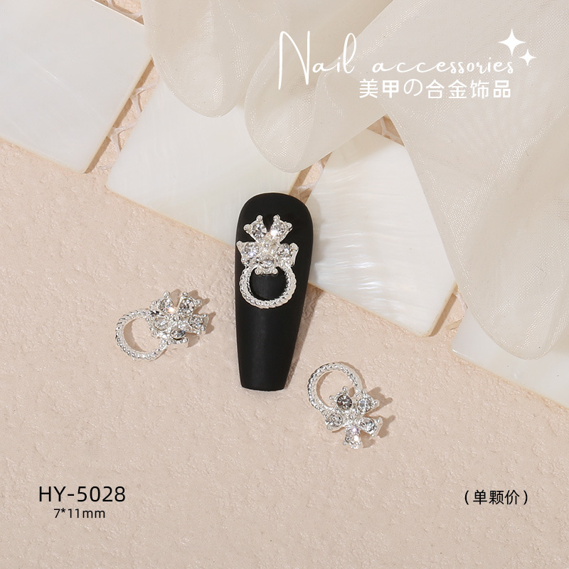 Nuevo arco de uñas amor aleación decoración de uñas flor de la luna mariposa clavo taladro fábrica joyería al por mayor