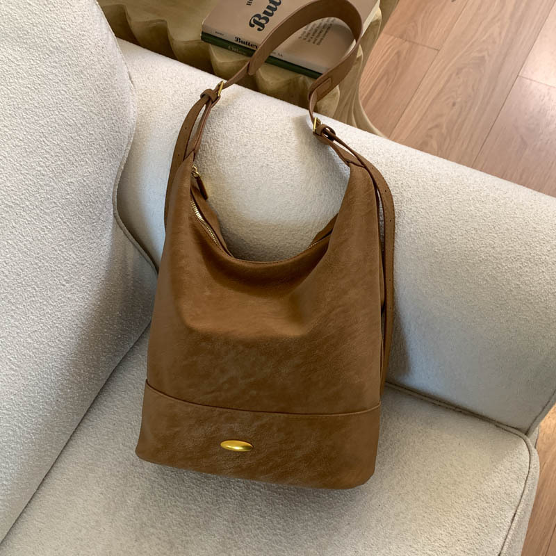 Coreano relajado sensación de colapsar bolso de cubo de seda bolso de mujer 2025 nuevo retro bolso de hombro bolso de viaje