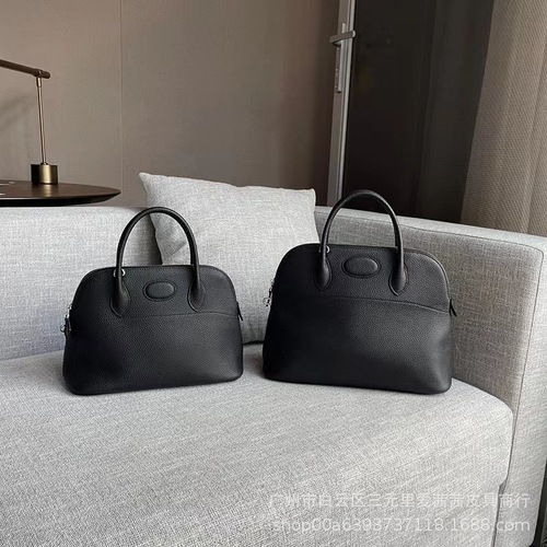 New Arrival Litchi-Grain Genuine Leather Bowling Ball Shell Bag  
Premium Full-Grain Cowhide Tote with Zipper Closure  
Spacious Casual Women's Handbag