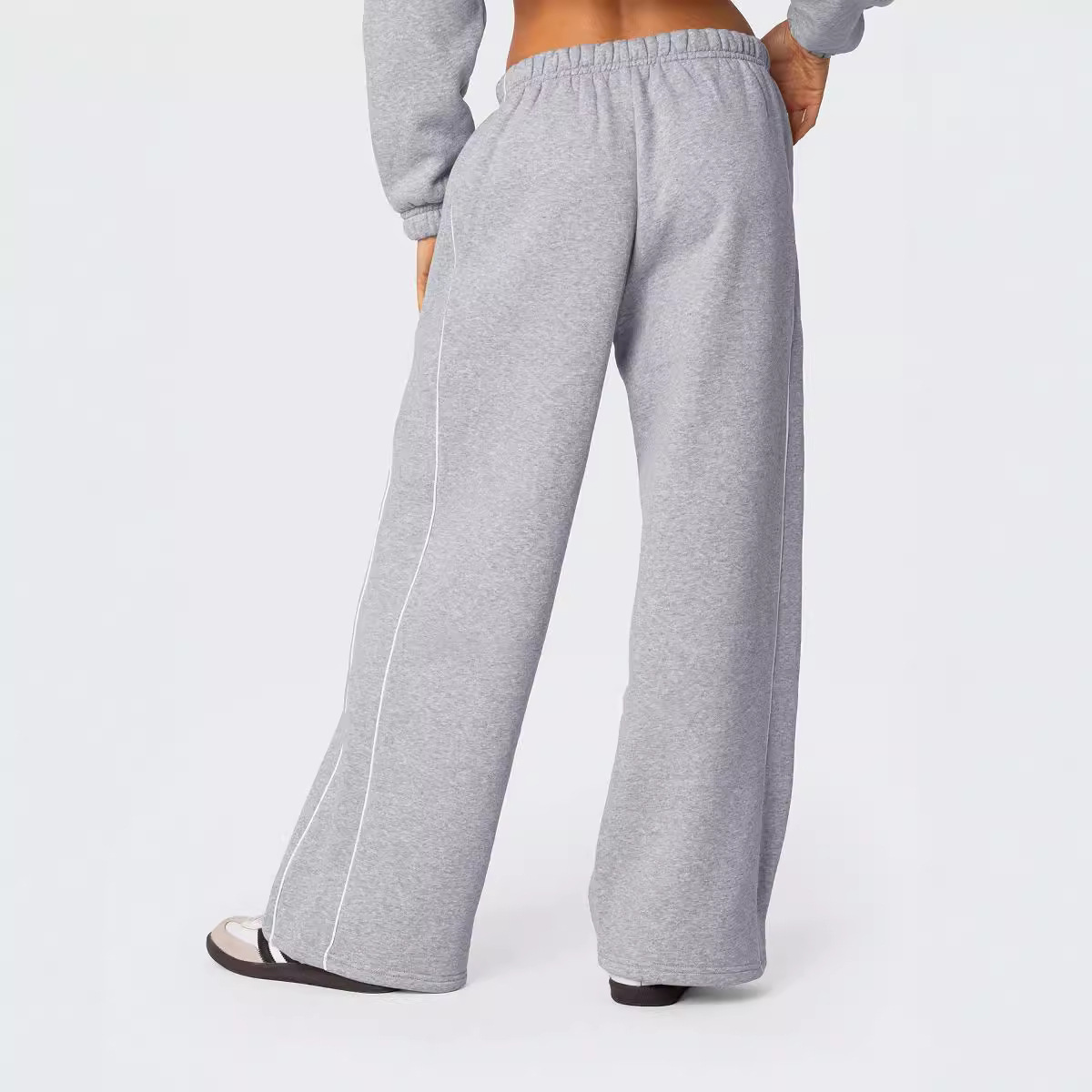 Europa y los Estados Unidos transfronterizos otoño y invierno personalidad callejera mujer blanco contraste rayas laterales casuales cintura elástica pantalones deportivos rectos