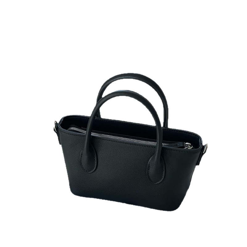 Mini bolsa de cesta de verduras de cuero minimalista 2025 nuevo estilo de piel de vaca Xiaozhong lingote bolso de mensajero portátil bolso de hombro femenino