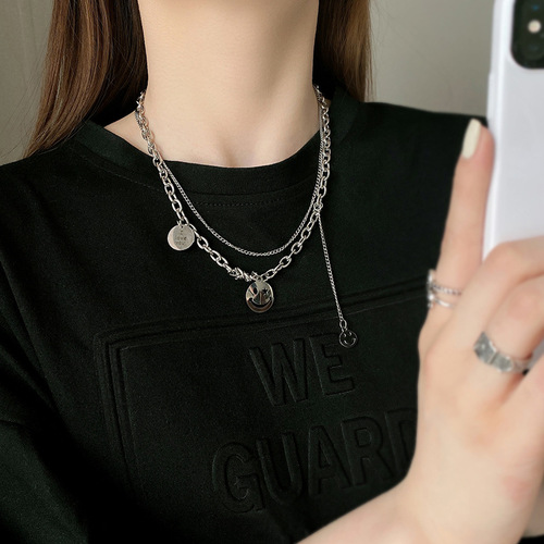 Instagram-worthy hip-hop smiley face necklace for women—delicate, minimalist design, lightweight luxury, niche aesthetic, made from titanium steel—perfect as a double-layered neck accessory.