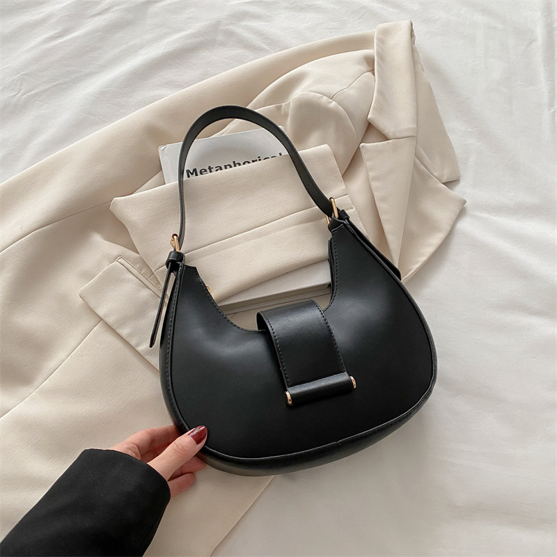 Bolso popular de este año para mujeres 2025, nueva moda de un solo hombro, bolso de diseño de nicho, bolso de media luna debajo de la axila