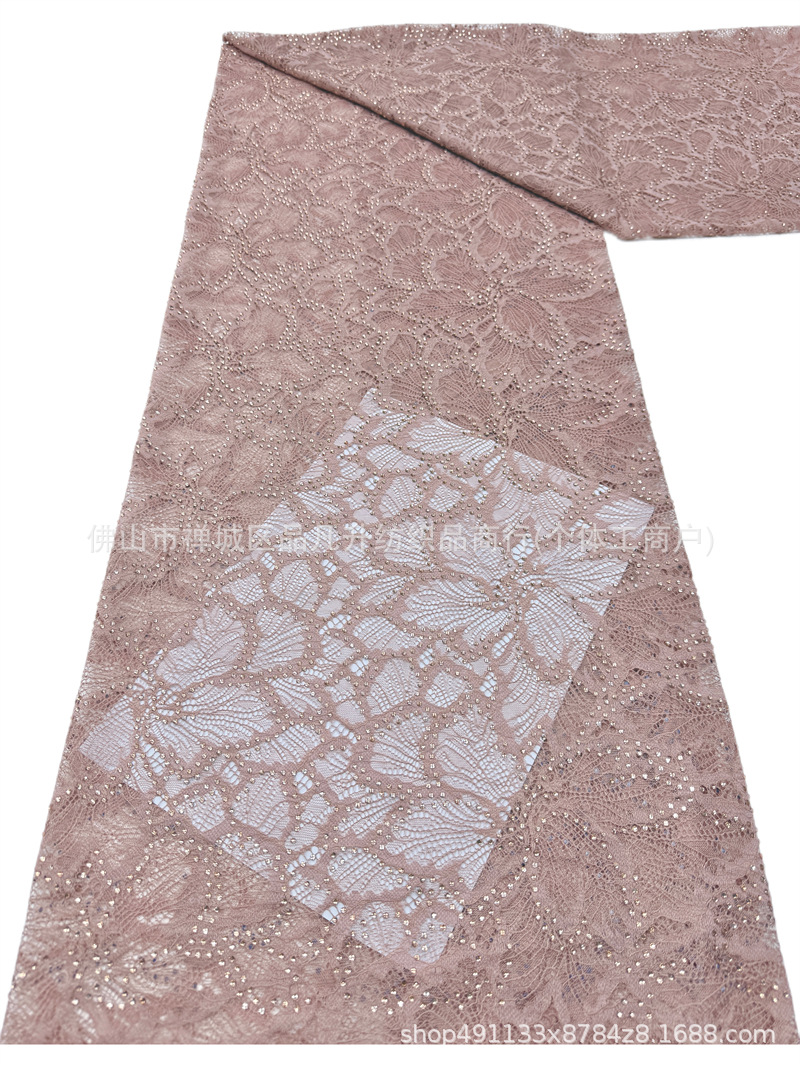 Nuevo hueco flor de encaje fondo tela de perforación caliente pesada cola de pez vestido de boda vestido de noche brindis tela spot