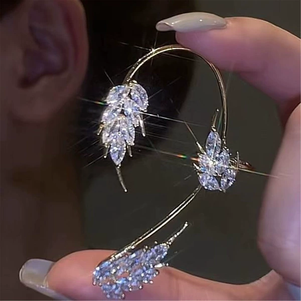 Feather earrings gold left