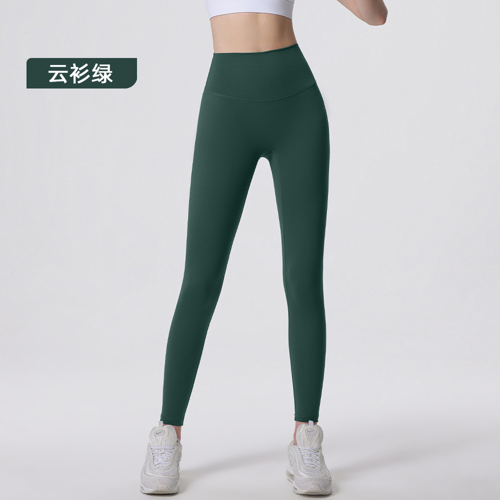 Nuevos deportes de yoga cintura alta desnuda sensación de no vergüenza línea piel-friendly levantamiento de la cadera del vientre que no se contrae la caída de la aptitud de las mujeres pantalones recortados