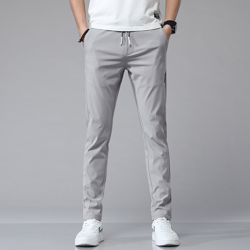 Pantalones casuales de hielo delgados de verano transfronterizos elásticos delgados de hombre 2026 nuevos pantalones deportivos de secado rápido