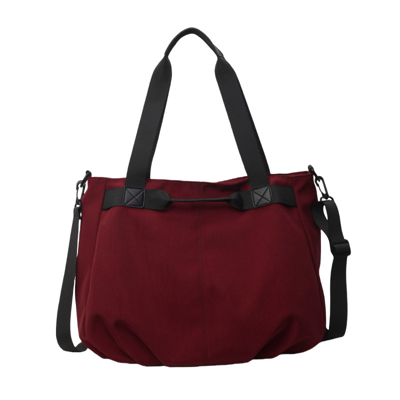 Bolsos de viaje transfronterizos de gran capacidad Bolsos de tela Oxford simples de moda femenina Bolsos tote de todo fósforo Bolsos de hombro de moda coreana