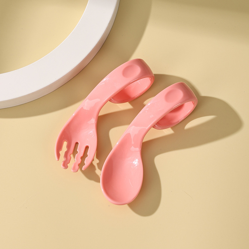 Cuchara horquilla curva rosa (bolsa)