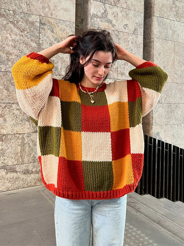 Suéter de manga larga suelta y versátil, personalidad de empalme de color contrastante para mujeres 2025, nuevo estilo de otoño y invierno transfronterizos