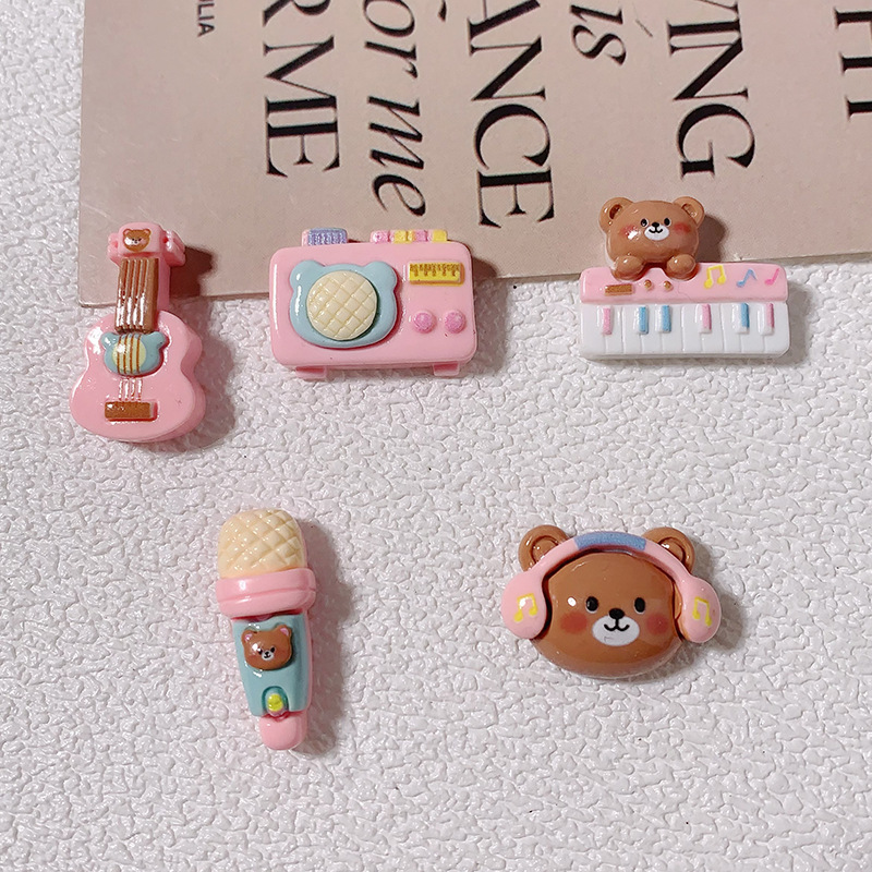 Nuevos dibujos animados brillante cara rosa osos joyería caja de teléfono celular agujero agujero cordón de cabeza de zapato DIY accesorios de resina de pegamento de crema