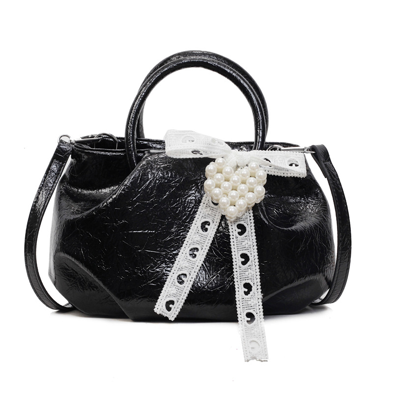 Bolso de diseño de nicho 2025 verano nuevo bolso femenino bolso de hombro de textura de alta gama bolso de mensajero de patrón de agarre de mano de moda