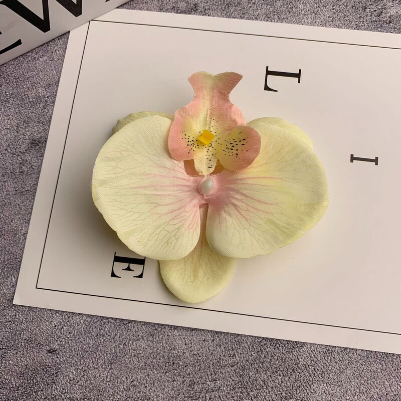 絹布の胡蝶蘭の花の頭は花の壁の部品の花の材料の頭をシミュレーションして髪を飾ってdiyの手作りの結婚祝いの贈り物を挟んで造花を飾ります。|undefined