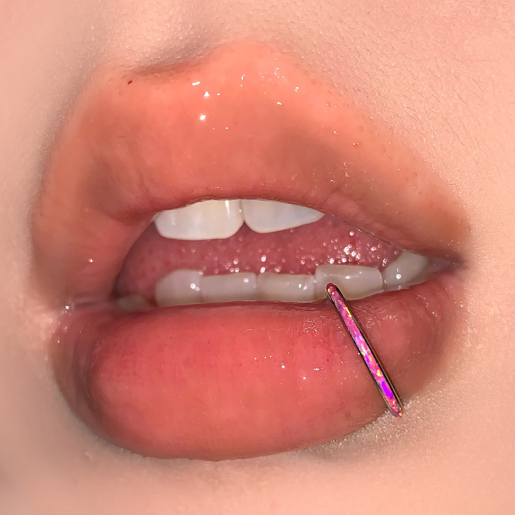 Silver pointed spike labret stud material detail