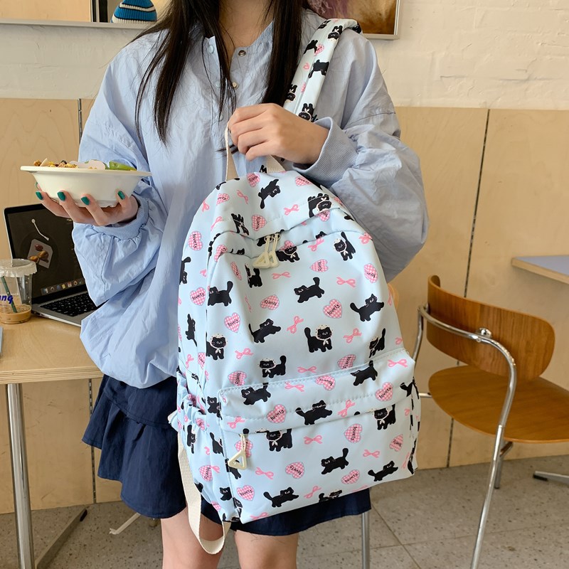 2025 nueva mochila caricatura encantadora impresión mochila de estudiantes de primaria y secundaria mochila de viaje ligera de gran capacidad