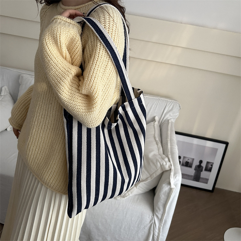 Bolsa de lona a rayas coreana simple bolso de hombro de estudiantes de literatura y arte gran capacidad de lazo bolso de mano