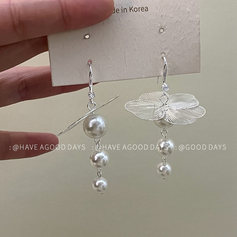 A pair of silver white pearls