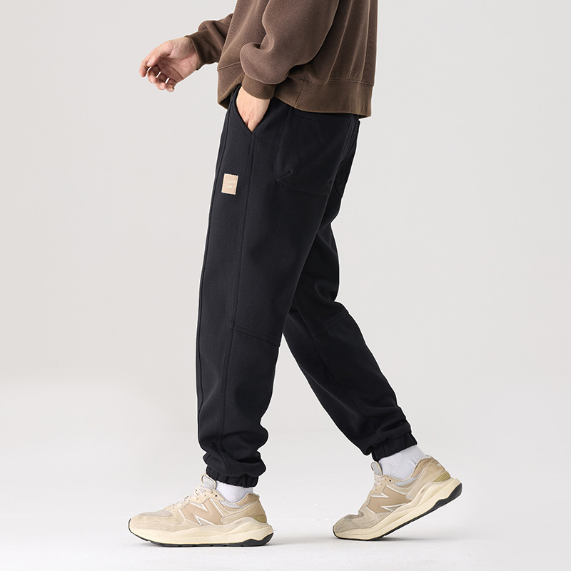 Mick Jones2025 caño hombre pantalones casuales holgados versátiles estilo coreano pantalones deportivos largos negros regulares