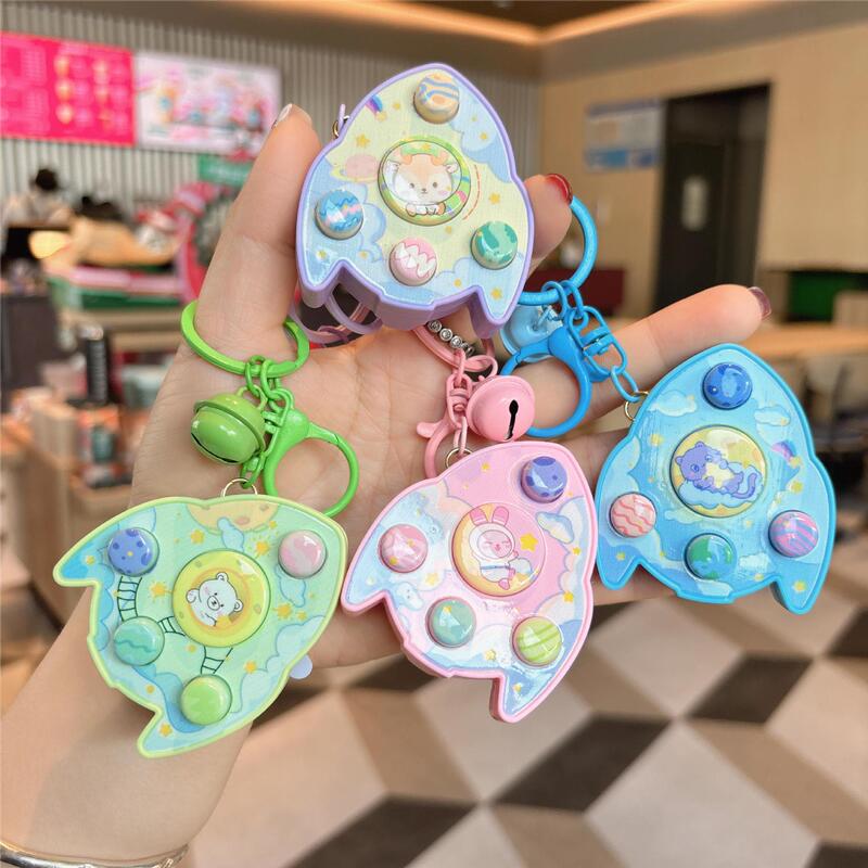 Cross-border Creative Children's Luminous Cartoon Rocket Sound Memory Electronic Game Machine Bag Pendant Doll Machine Toy