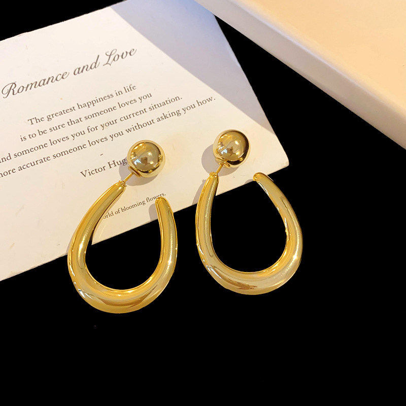 Aguja de plata MEDIADOS DE-antigua flor redonda borla pendientes de metal retro europeo y americano elegante luz pendientes de lujo al por mayor para las mujeres