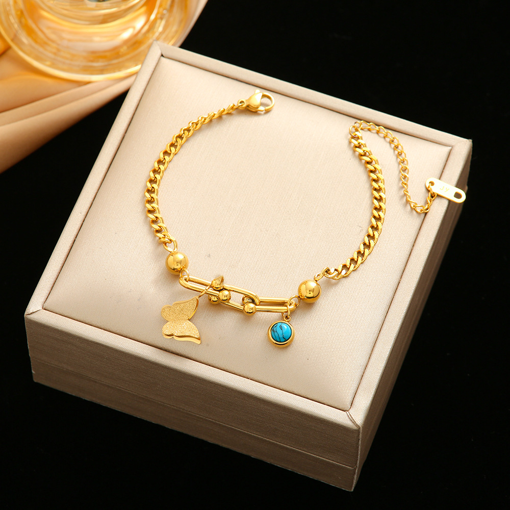 Pulsera de trébol de acero titanium vendedora caliente transfronteriza europea y americana con incrustaciones de concha pulsera colgante pulsera de diseño avanzado sin desvanecimiento al por mayor