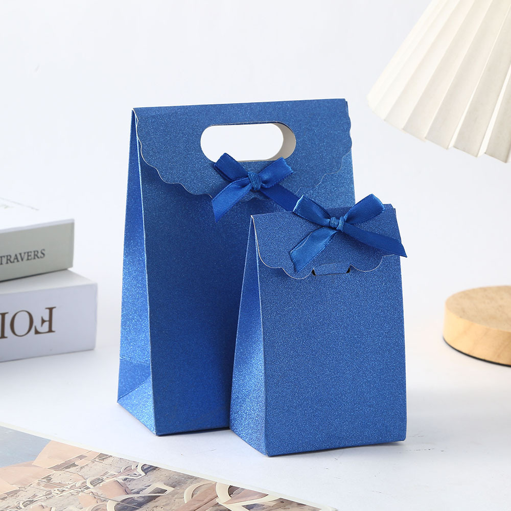 Bolsa de papel de cartón blanco con solapa de cebolla brillante Bolsa de embalaje de regalo de color caramelo Bolsa de embalaje de postre con lazo de sentido avanzado Bolsa de caramelo