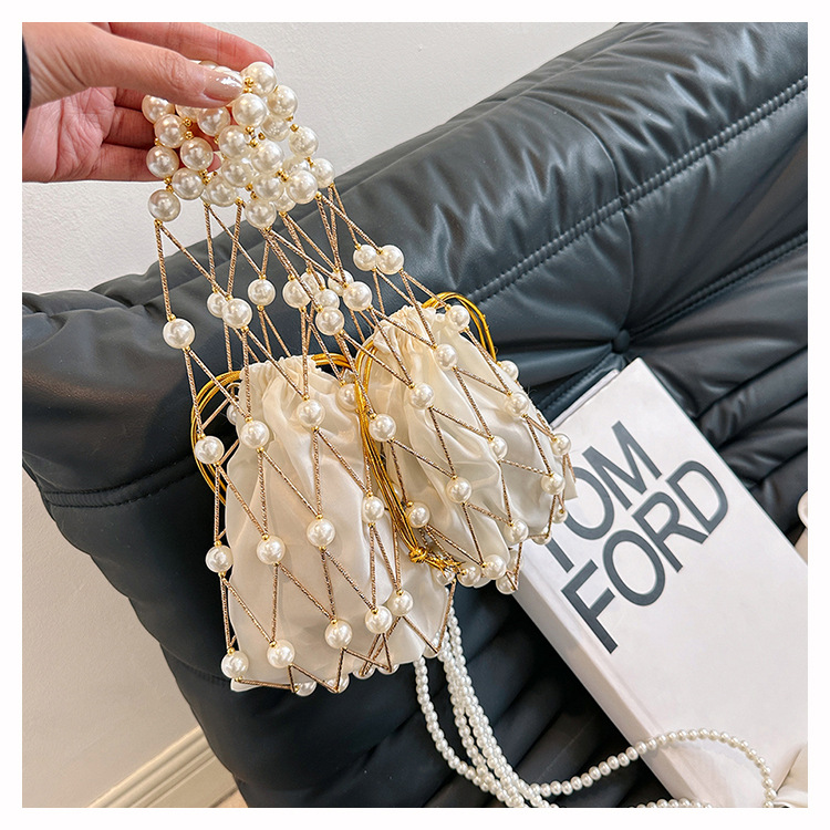 Women's Small Plastic Solid Color Vacation Beach Pearls Hollow String Beach Bag display picture 5