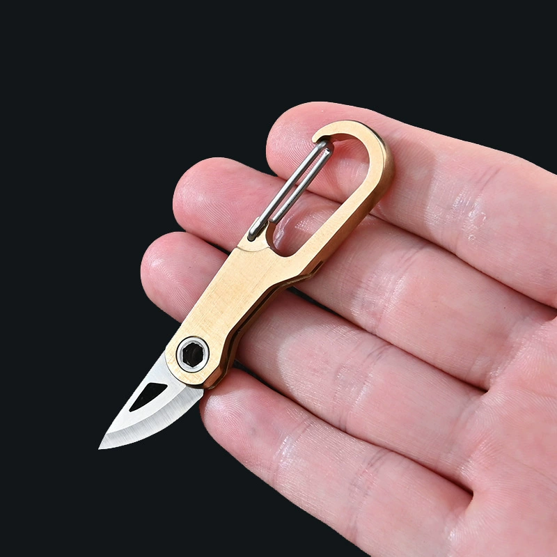 Brass keychain, sharp pocket knife, handheld box