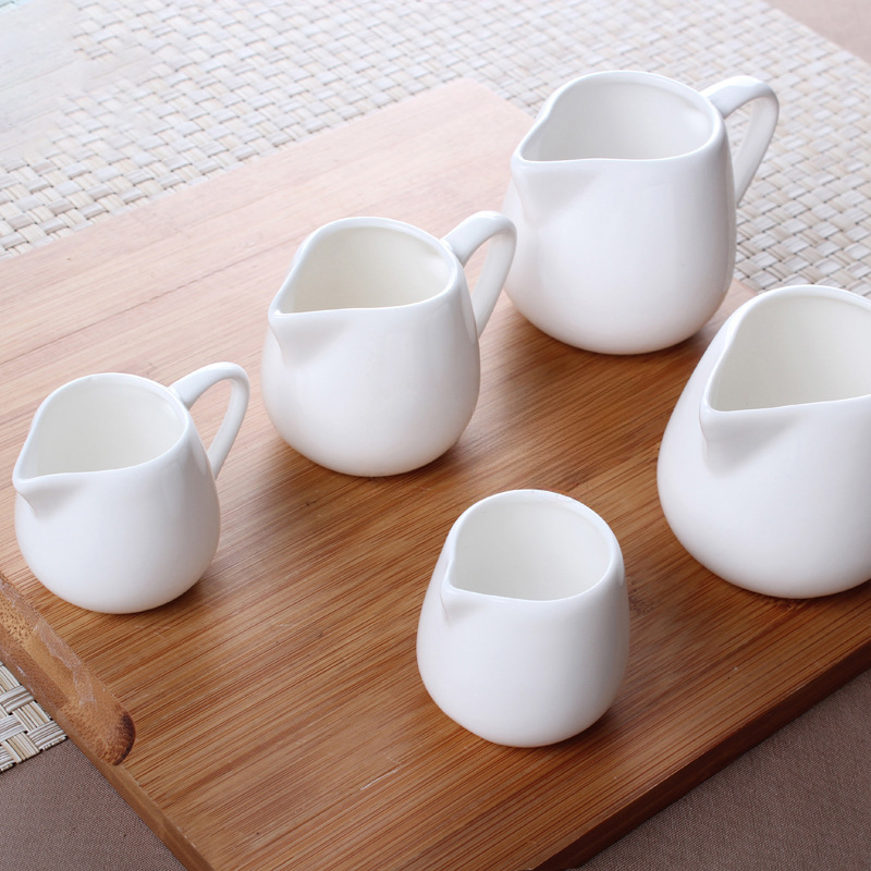 小さいミルクの杯の陶磁器のミニのミルクの缶の蜂蜜のミルクの杯のコーヒーのミルクの瓶のミルクのスプーンのヨーロッパ式のステーキのジュースの砂糖の缶|undefined