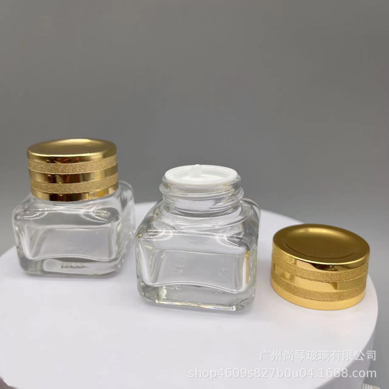 En stock suministro 15g Yashi mismo estilo marrón/transparente cuadrado ojo crema botella de vidrio de fondo grueso botella de vidrio cosméticos sub-embalaje