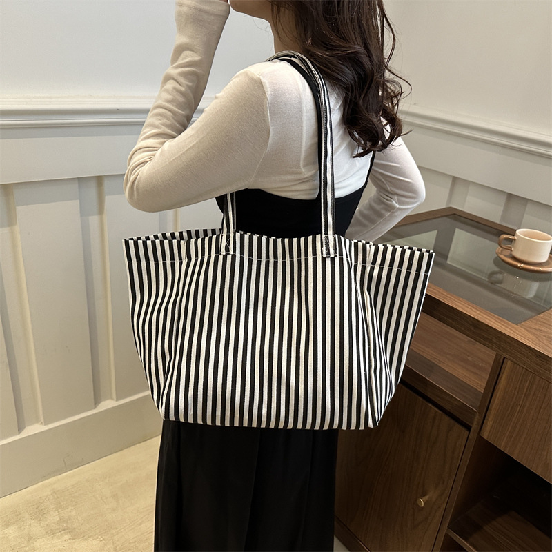 Bolsas de lona a rayas de otoño de mujeres bolsas 2024 nuevas bolsas de mano populares bolsas de hombro casuales de gran capacidad bolsas tote